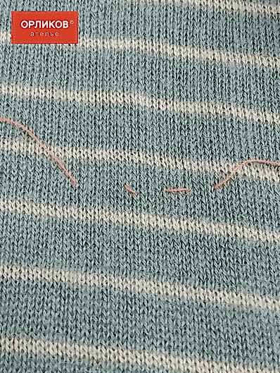 Повреждение на трикотажной кофте после устранения