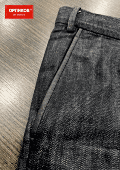 Карман на серых джинсах после ремонта